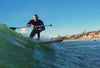 Man Riding A Wave On The Classic Surf