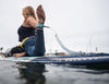 Women Doing Yoga On Glider Paddle Board