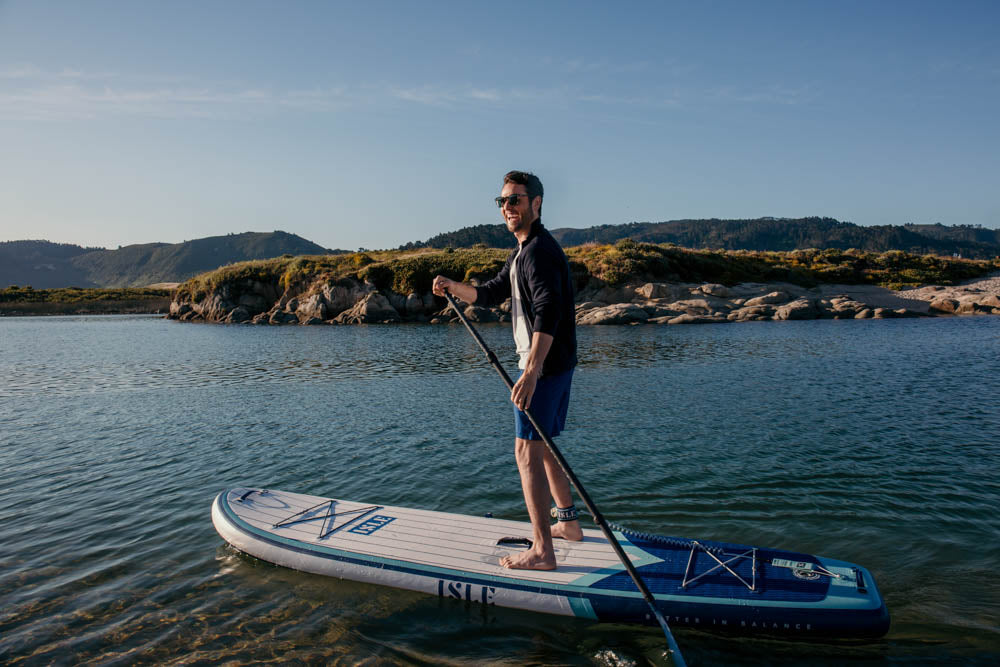 man paddling, smiling