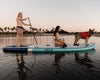 A Couple & Their Dog On The Megalodon Paddle Board
