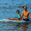 Man & Kid On The Versa Paddle Board In The Water